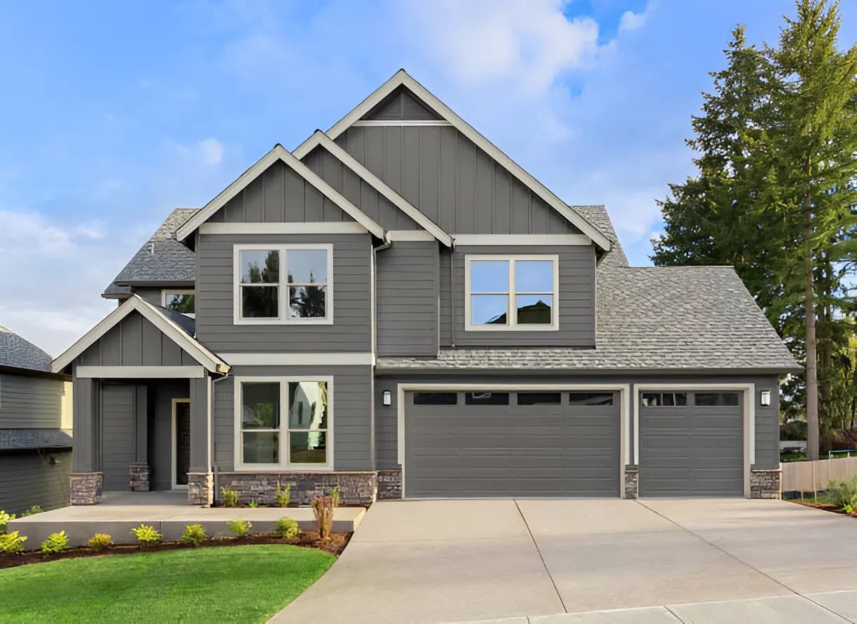 Gray painted home exterior with siding and trim by a painter in Ashland, MA