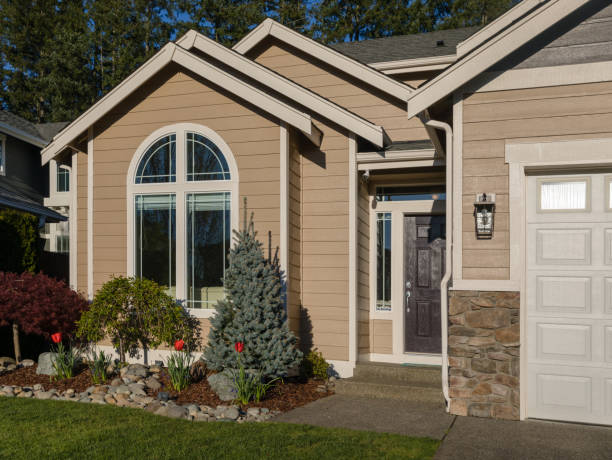 Freshly painted home exterior with repaired siding and trim, showcasing clean lines and a durable finish by a painter in Dover, MA