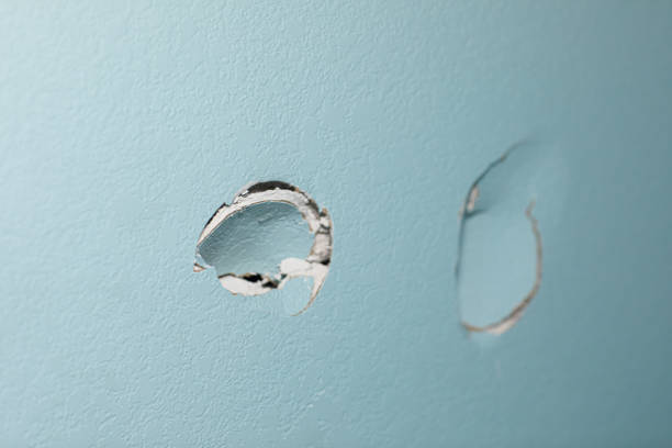 Drywall damage requiring repair before a fresh coat of paint by an interior painter in Sherborn, MA.
